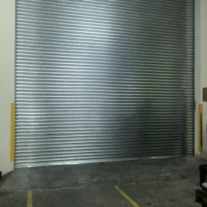 Galvanised industrial roller shutter installation for factory in Singapore